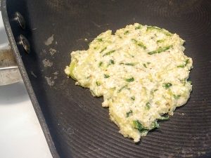 zucchini fritters on griddle